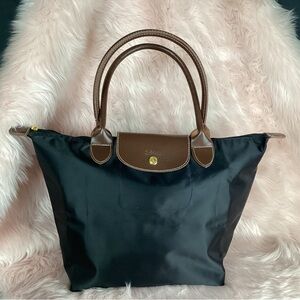 Longchamp large black nylon tote with leather straps and trim with gold hardware
